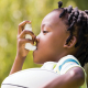 child with asthma inhaler