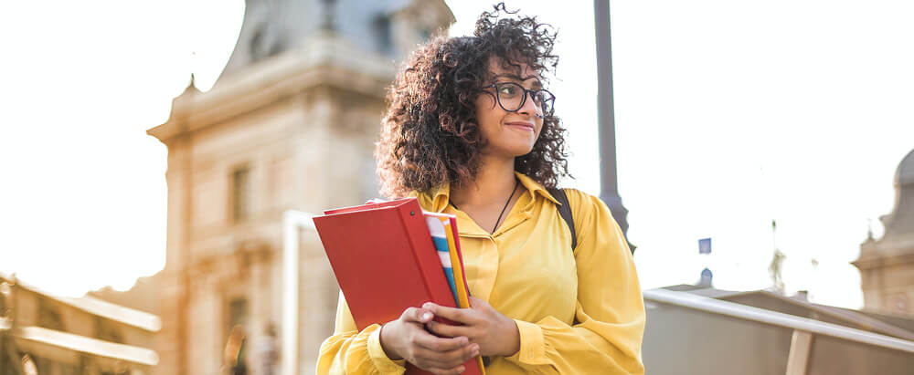 College student with books and allergies