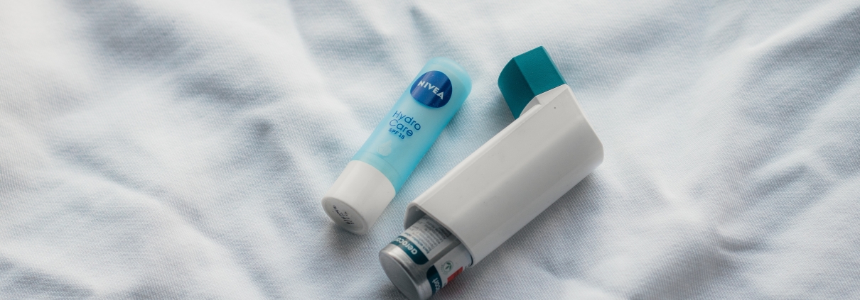Chapstick next to an inhaler