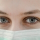 Close up of a women's face and eyes. She is wearing a mask.