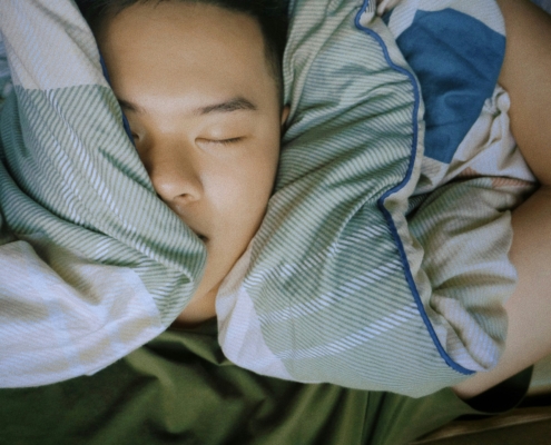 Person sleeping soundly with trusted asthma specialist care.