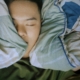 Person sleeping soundly with trusted asthma specialist care.