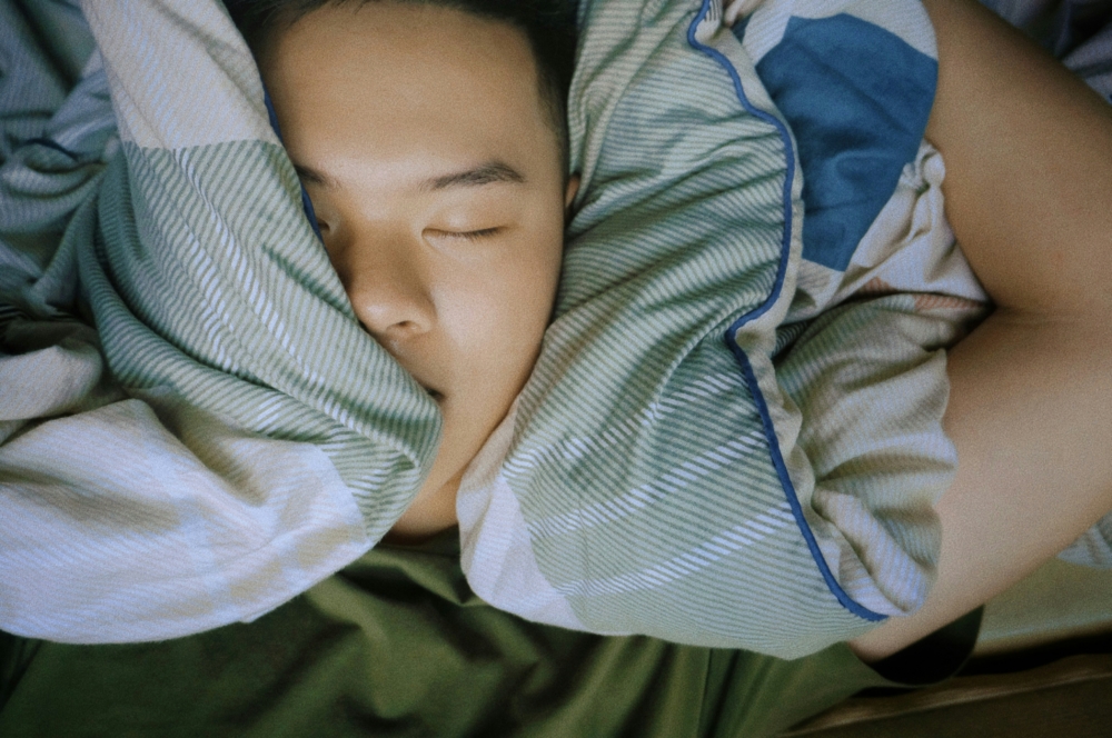 Person sleeping soundly with trusted asthma specialist care.