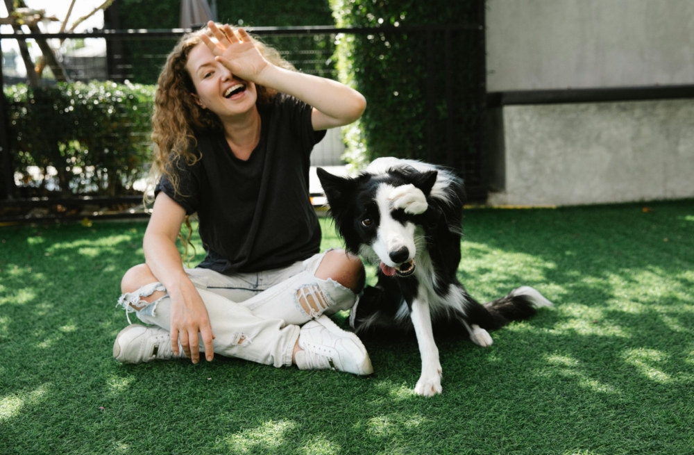 Woman and dog living a happy life free of pet allergy symptoms