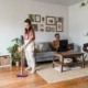 Woman vacuuming to remove dust mites and reduce allergy symptoms.