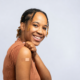 Woman smiling after receiving an allergy shot to treat her allergy symptoms