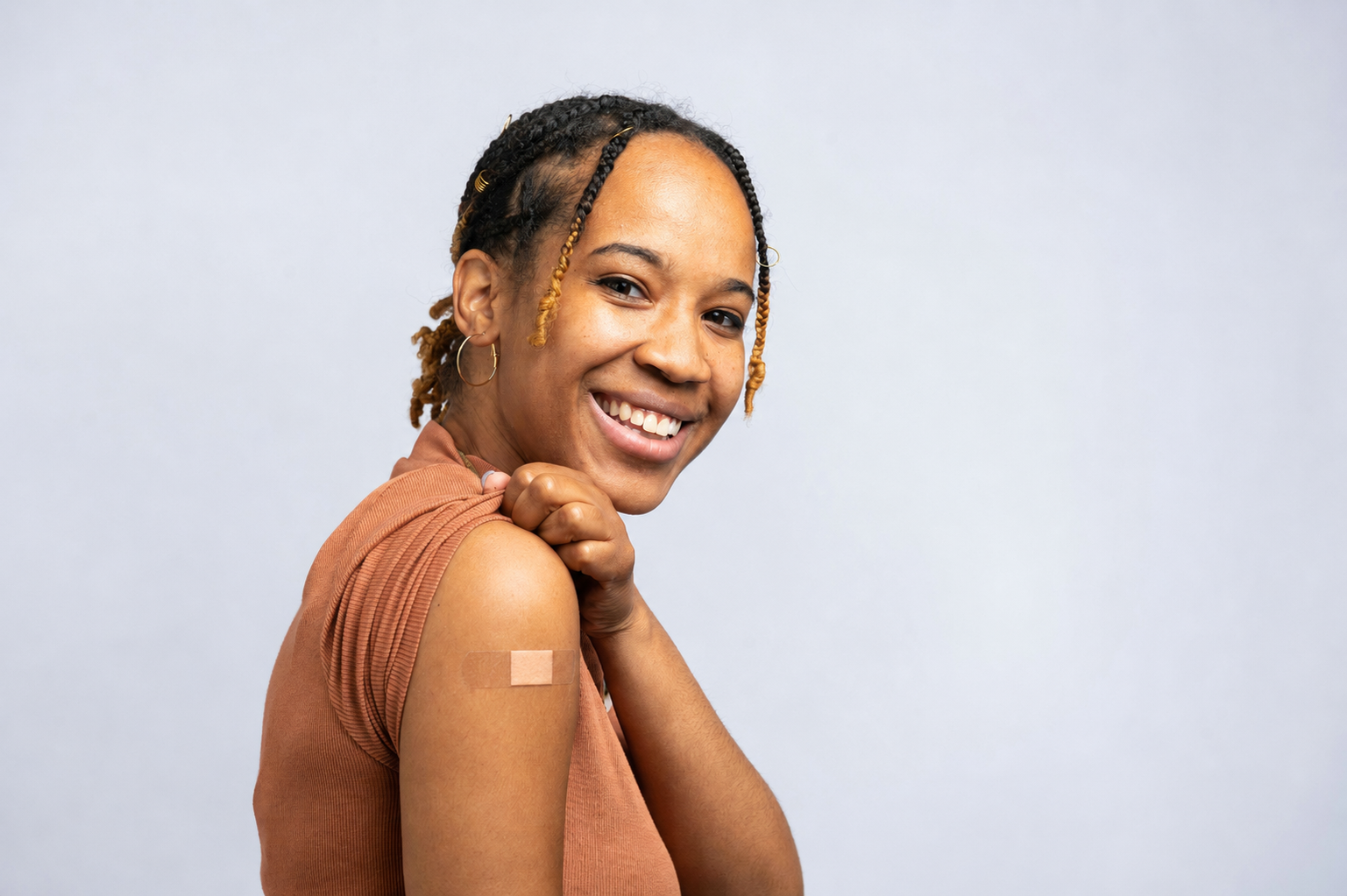 Woman smiling after receiving an allergy shot to treat her allergy symptoms