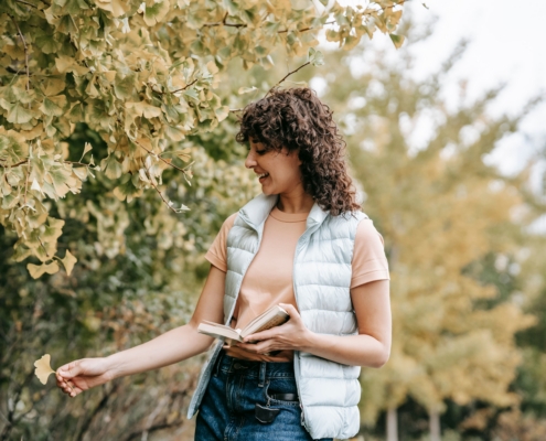 Woman enjoying the outdoors with managed asthma symptoms during fall allergy season